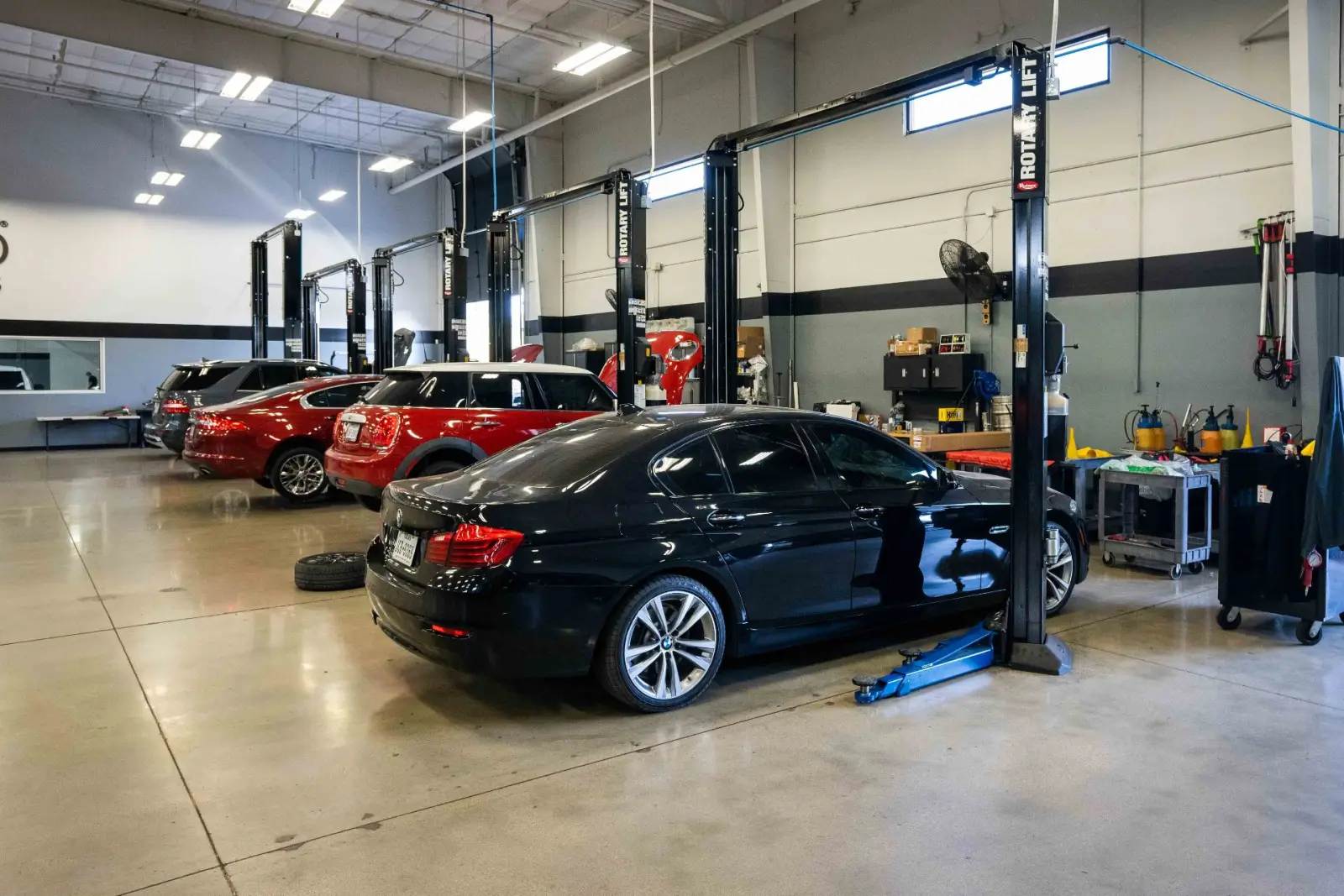 Interior of Total Auto Works auto repair shop in Austin, Texas with service bays and lifts